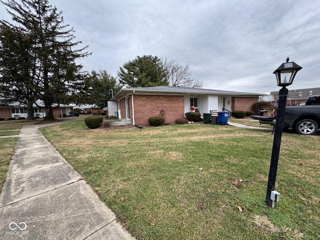 view of side of home featuring a yard