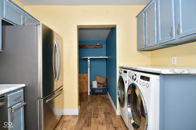 washroom with dark hardwood / wood-style flooring and washer and dryer