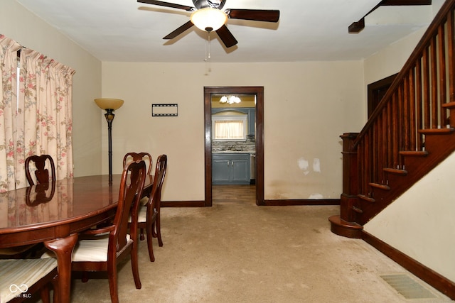 dining space with ceiling fan