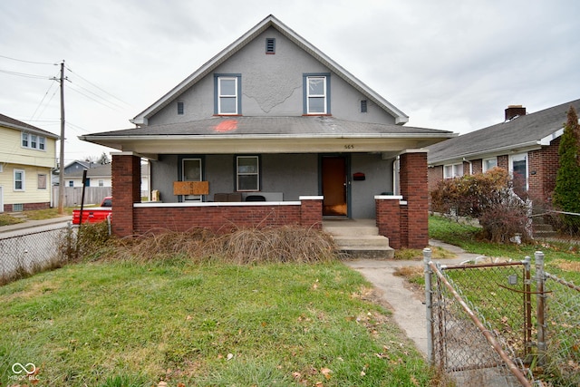 view of front facade with a front yard and a porch