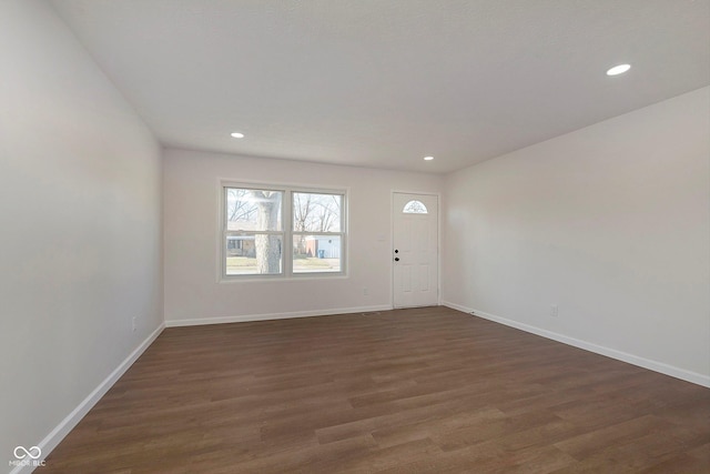 foyer entrance featuring dark wood-type flooring