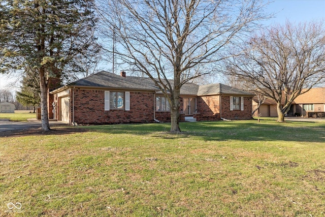 ranch-style home with a front yard and a garage