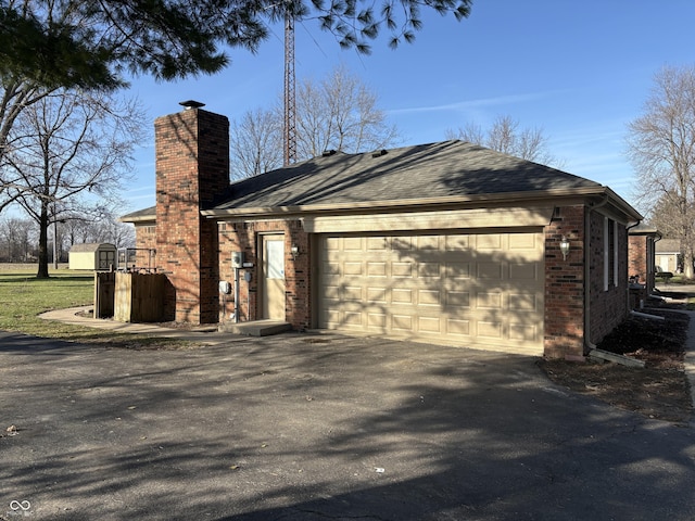 view of side of property with a garage