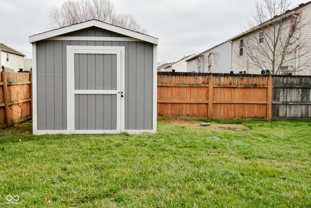 view of outdoor structure featuring a lawn