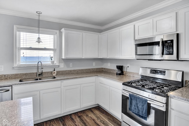 kitchen with crown molding, sink, white cabinetry, and stainless steel appliances