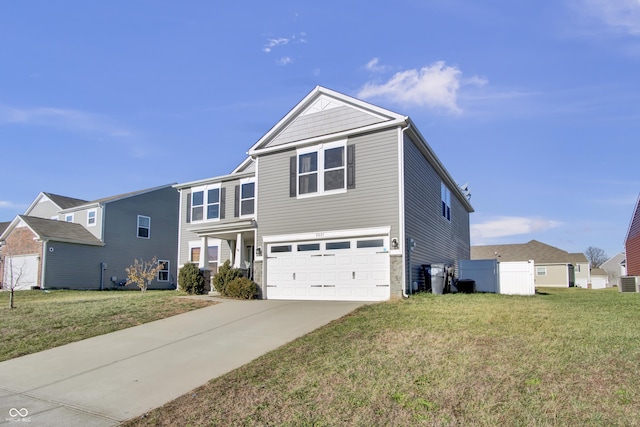 view of front property featuring a front yard and a garage