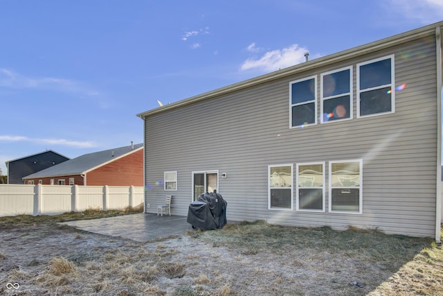 back of property with a patio area