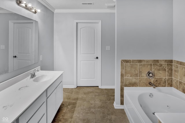 bathroom with a tub, vanity, and ornamental molding