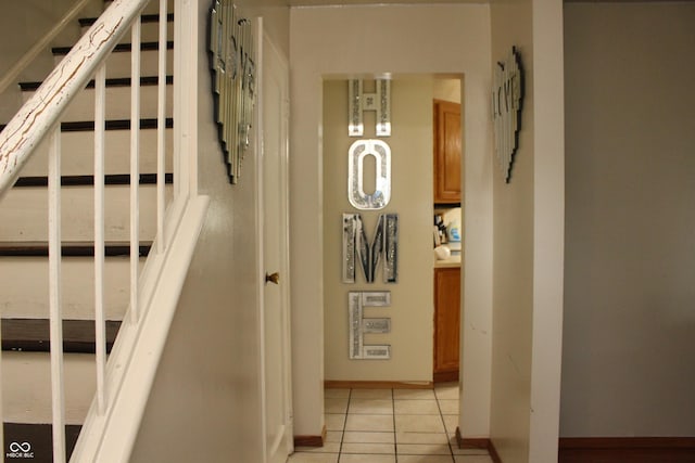 staircase featuring tile patterned floors