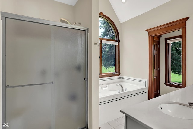 3592 W Smokey Row Rd, Bargersville, IN 46106 - bathroom featuring lofted ceiling, a shower stall, vanity, a garden tub, and tile patterned floors