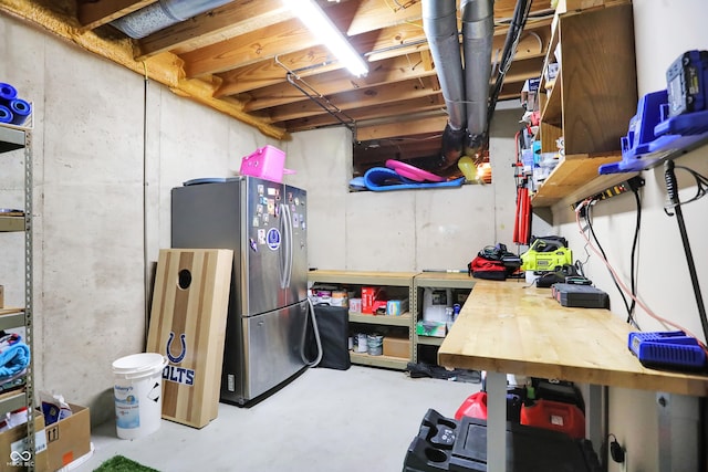 3592 W Smokey Row Rd, Bargersville, IN 46106 - unfinished basement with freestanding refrigerator and a workshop area