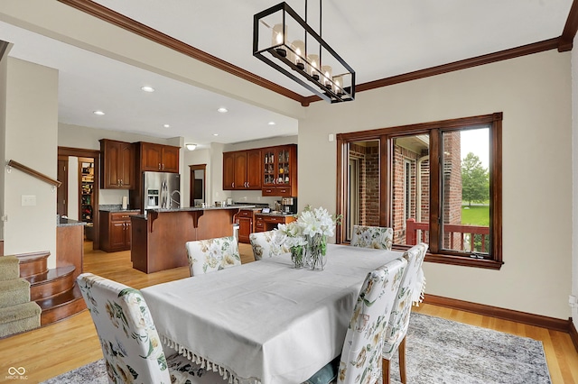 3592 W Smokey Row Rd, Bargersville, IN 46106 - dining area with crown molding, light wood finished floors, a chandelier, and recessed lighting