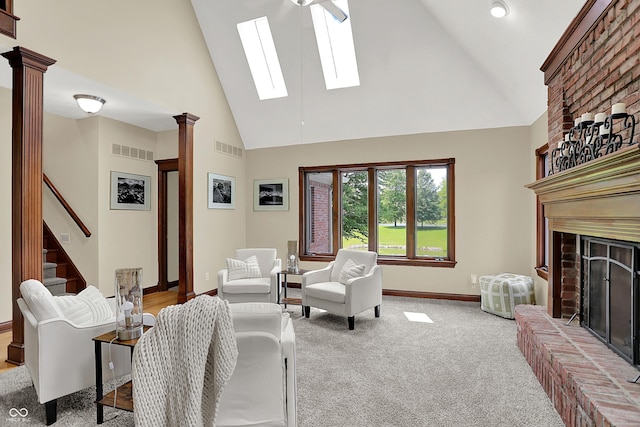 3592 W Smokey Row Rd, Bargersville, IN 46106 - living room with high vaulted ceiling, ornate columns, a skylight, a fireplace, and carpet flooring