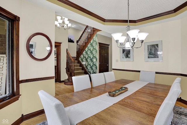 3592 W Smokey Row Rd, Bargersville, IN 46106 - dining space with a chandelier, stairway, light wood finished floors, and ornamental molding