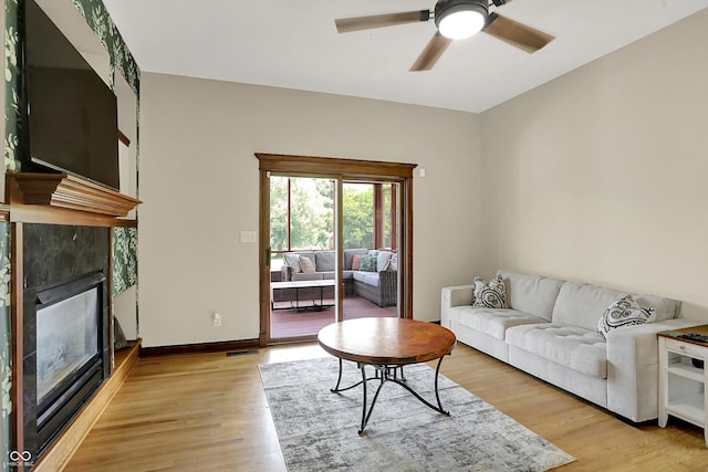 3592 W Smokey Row Rd, Bargersville, IN 46106 - living area with a fireplace, light wood finished floors, and a ceiling fan