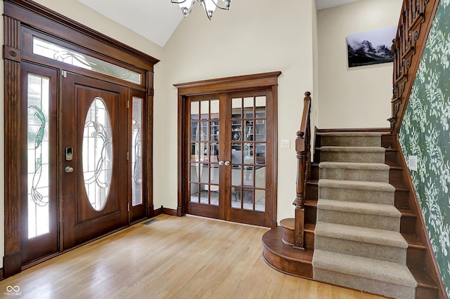 3592 W Smokey Row Rd, Bargersville, IN 46106 - foyer featuring french doors, stairs, light wood-style flooring, plenty of natural light, and lofted ceiling