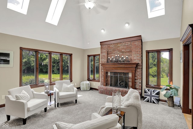 3592 W Smokey Row Rd, Bargersville, IN 46106 - carpeted living area with a skylight, high vaulted ceiling, a fireplace, a ceiling fan, and recessed lighting