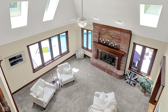 3592 W Smokey Row Rd, Bargersville, IN 46106 - carpeted living area featuring a skylight, a fireplace, plenty of natural light, recessed lighting, and high vaulted ceiling