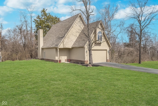 3592 W Smokey Row Rd, Bargersville, IN 46106 - view of home's exterior featuring asphalt driveway, a chimney, a lawn, and an attached garage