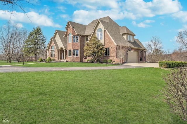 3592 W Smokey Row Rd, Bargersville, IN 46106 - view of front of home featuring brick siding, concrete driveway, a front lawn, and roof with shingles
