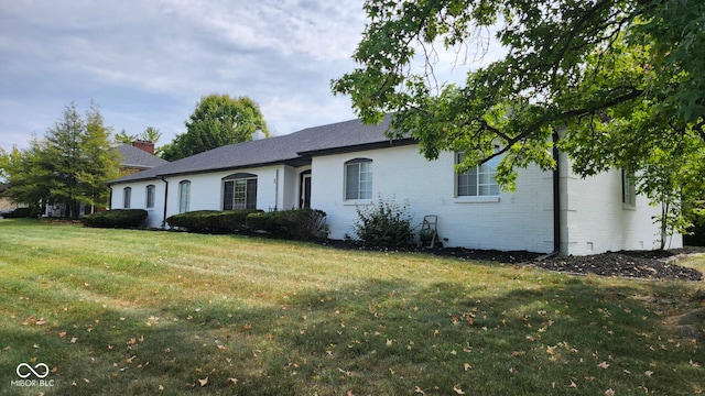 ranch-style home with a front yard