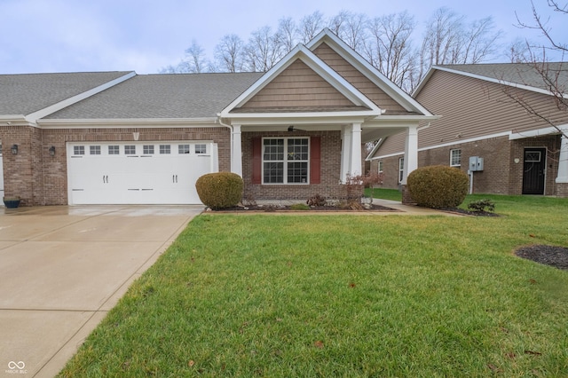 view of front of property with a garage, brick siding, driveway, roof with shingles, and a front yard