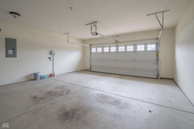 garage featuring a garage door opener and electric panel