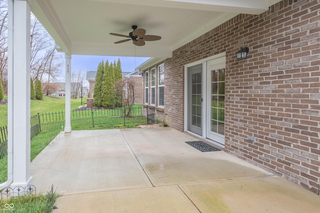 view of patio / terrace featuring fence and a ceiling fan