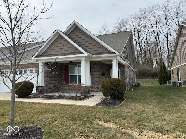 view of front of house with brick siding and a front yard