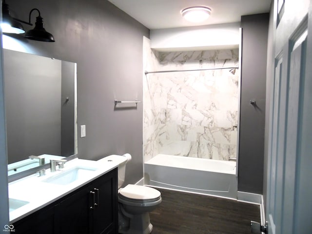 full bathroom featuring hardwood / wood-style flooring, vanity, toilet, and shower / bath combination