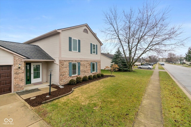 view of side of home with a garage and a lawn