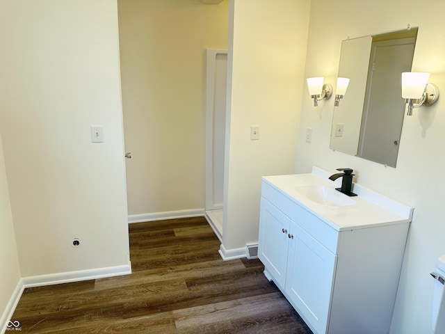 bathroom featuring hardwood / wood-style floors and vanity