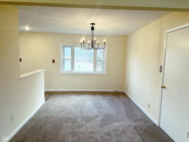 unfurnished dining area with carpet flooring and an inviting chandelier