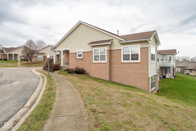 view of property exterior with a yard