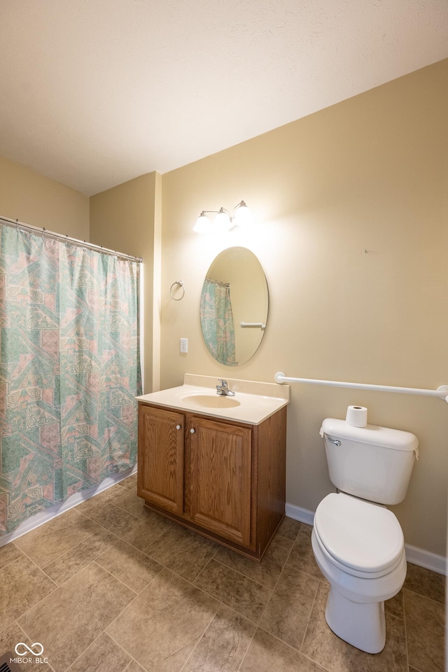 bathroom with vanity, toilet, and a shower with shower curtain