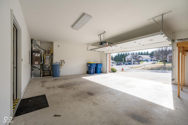 garage with heating unit, a garage door opener, and water heater