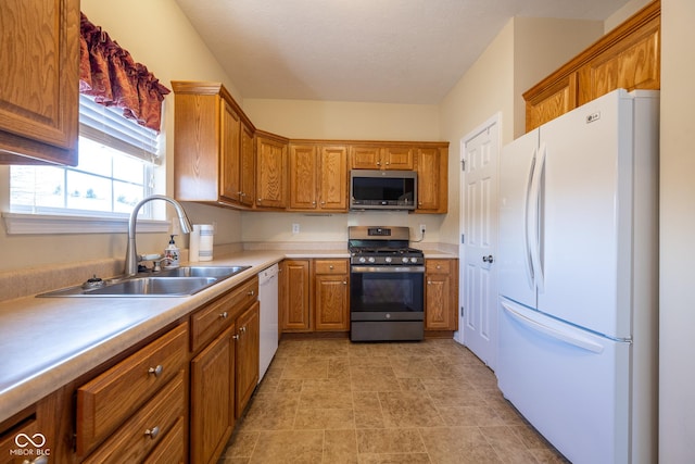 kitchen featuring sink, stainless steel appliances, and a textured ceiling