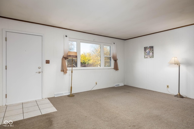 entryway featuring light colored carpet