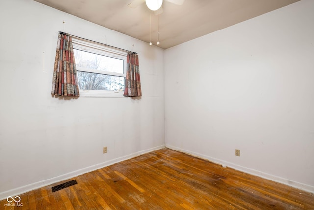 empty room featuring ceiling fan and wood-type flooring