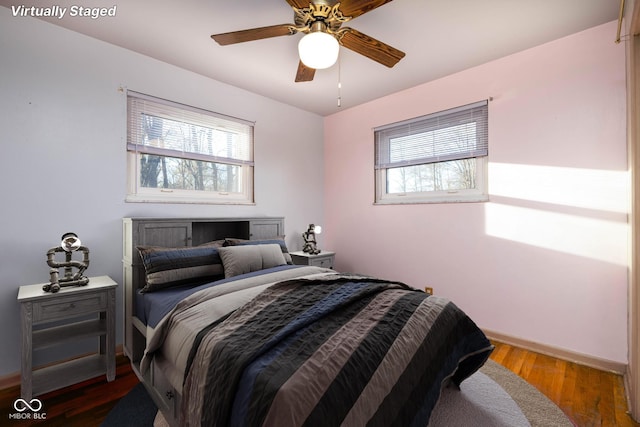 bedroom featuring hardwood / wood-style floors and ceiling fan