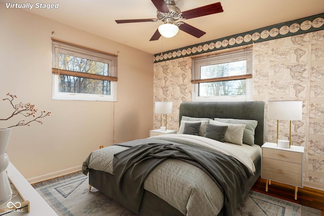 bedroom featuring ceiling fan and wood-type flooring