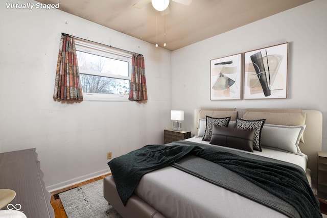 bedroom featuring ceiling fan and wood-type flooring