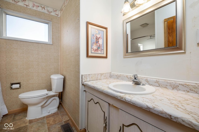 bathroom with vanity and toilet