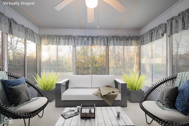 sunroom with ceiling fan