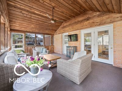 sunroom featuring french doors, wood ceiling, and lofted ceiling