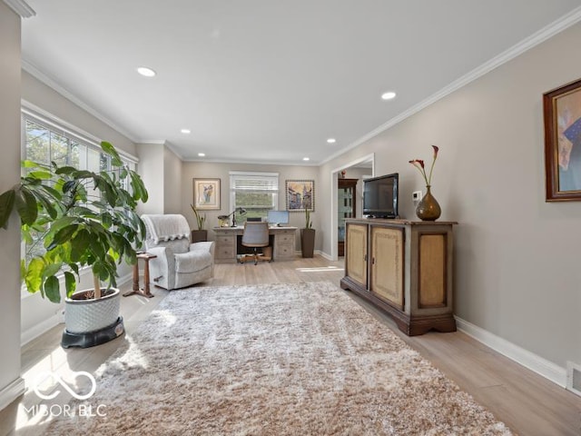 living room with crown molding and light hardwood / wood-style flooring