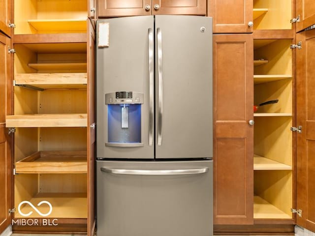 kitchen with stainless steel fridge with ice dispenser