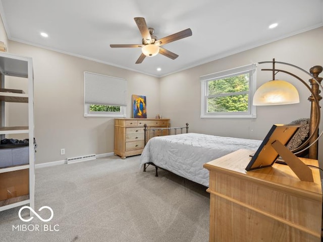 carpeted bedroom featuring ceiling fan and ornamental molding