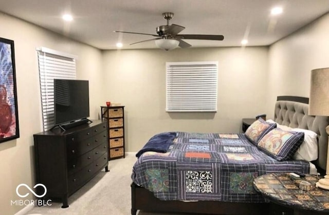 bedroom featuring ceiling fan and light colored carpet