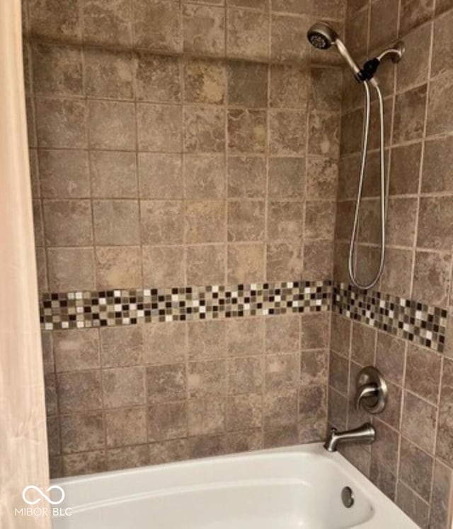 bathroom featuring shower / tub combo with curtain